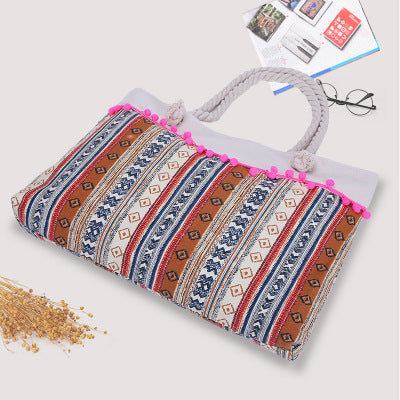 Large beach bag with crocheted embellishments 
Maetiva