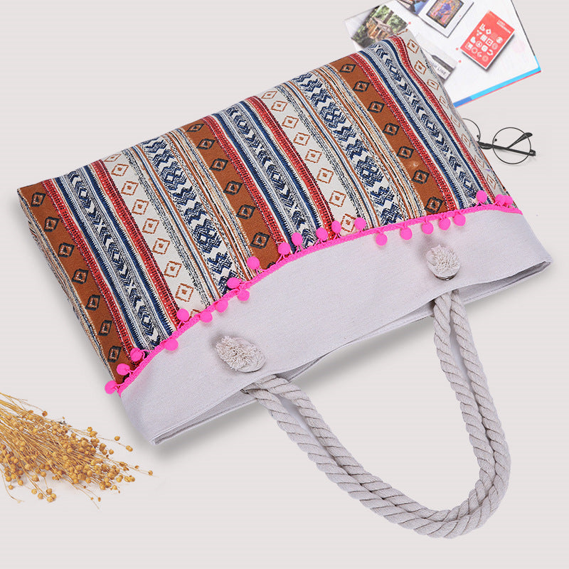 Large beach bag with crocheted embellishments 
Maetiva