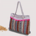 Large beach bag with crocheted embellishments 
Maetiva