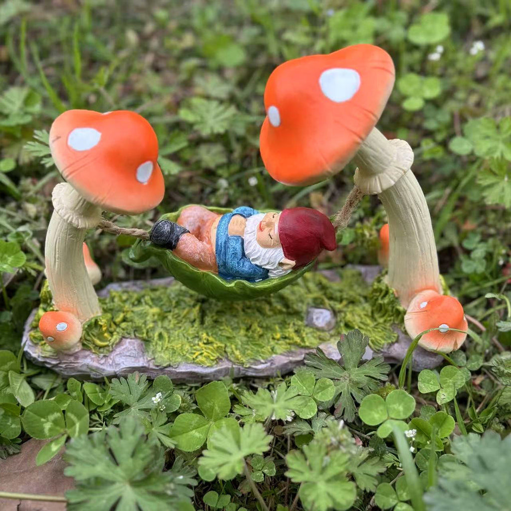 Garden decoration gnome in hammock made of synthetic resin