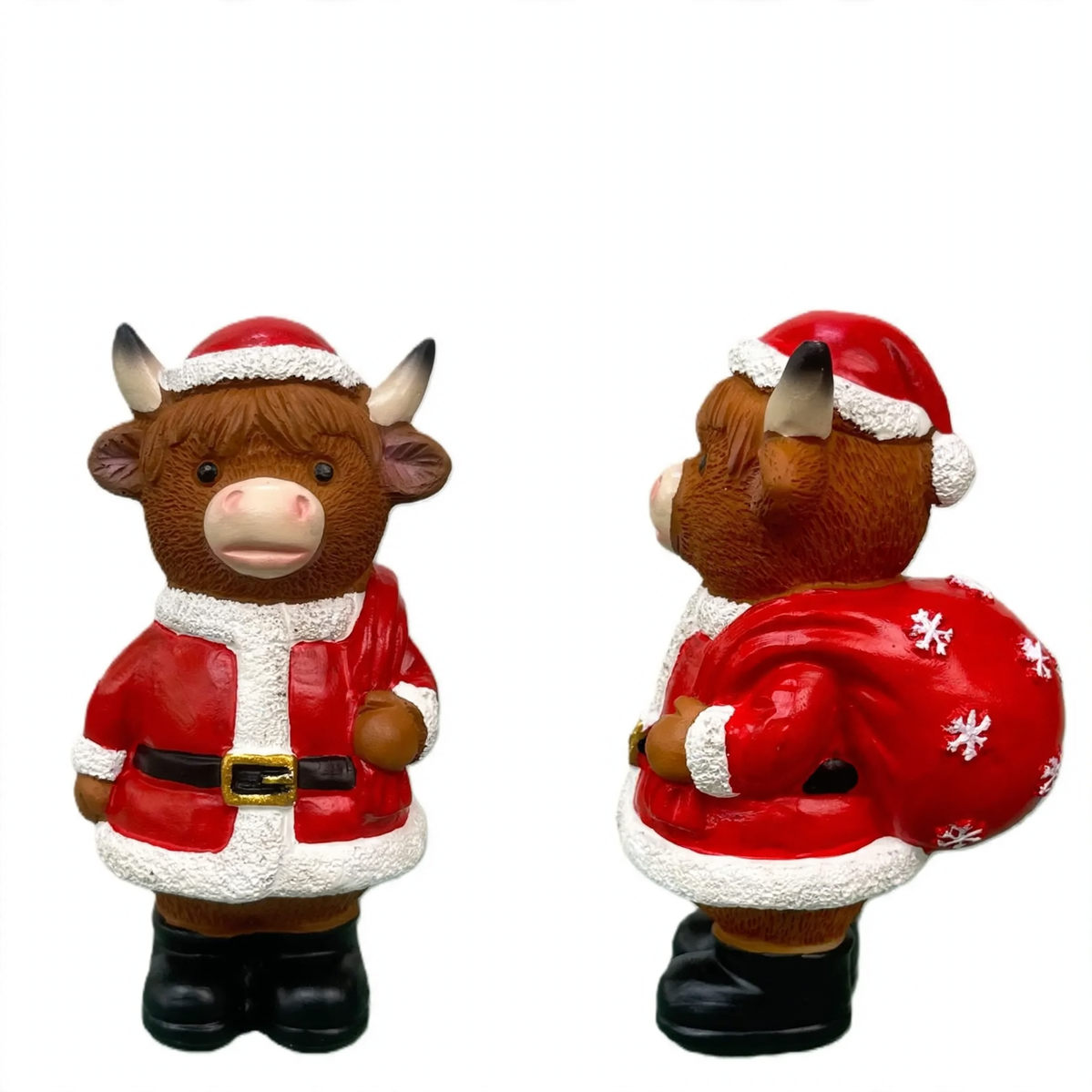 Decorative nutcracker and highland cattle figures made of resin