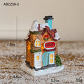 Illuminated Christmas house made of resin for table decoration