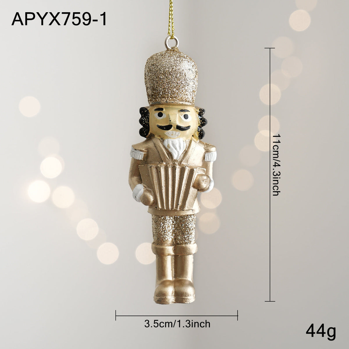 Golden nutcracker pendant made of resin for the Christmas tree