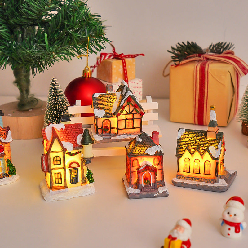 Illuminated Christmas cottage made of resin