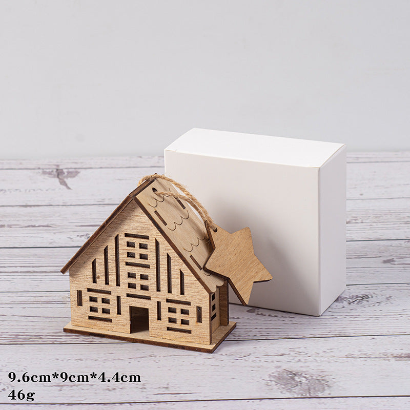 Illuminated wooden house for Christmas decoration