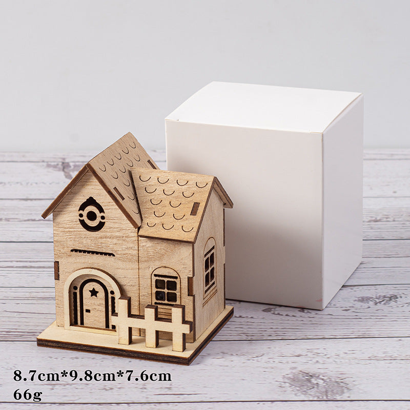Illuminated wooden house for Christmas decoration