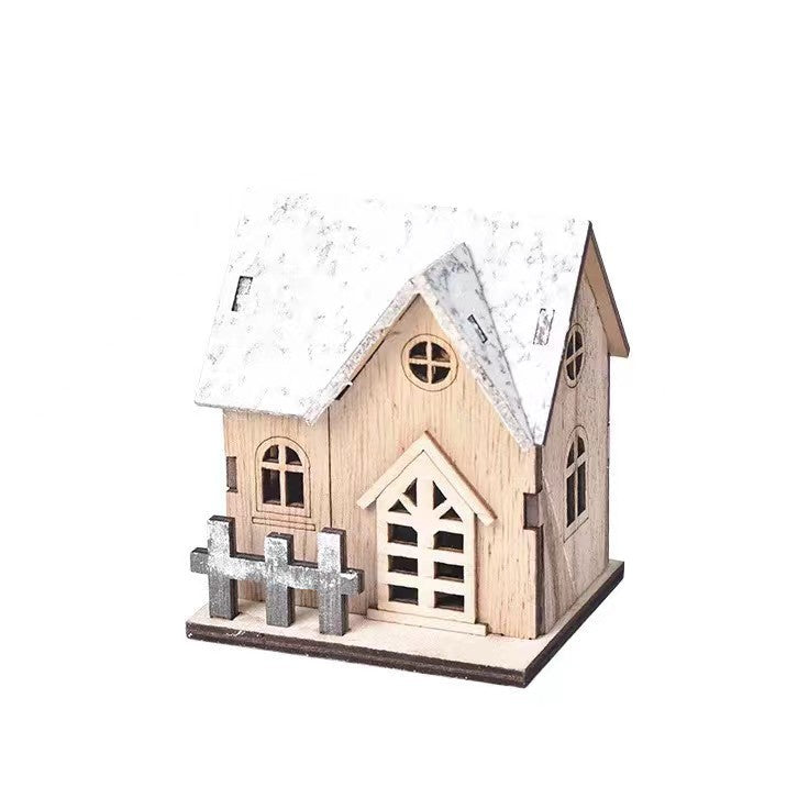Illuminated wooden house for festive table decoration