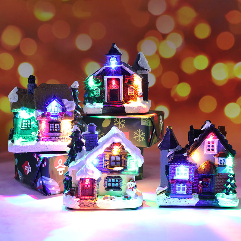 Illuminated miniature Christmas house made of resin