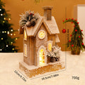 Illuminated Christmas Wooden House with Snow Landscape