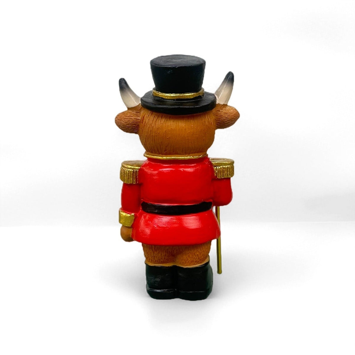 Decorative nutcracker and highland cattle figures made of resin