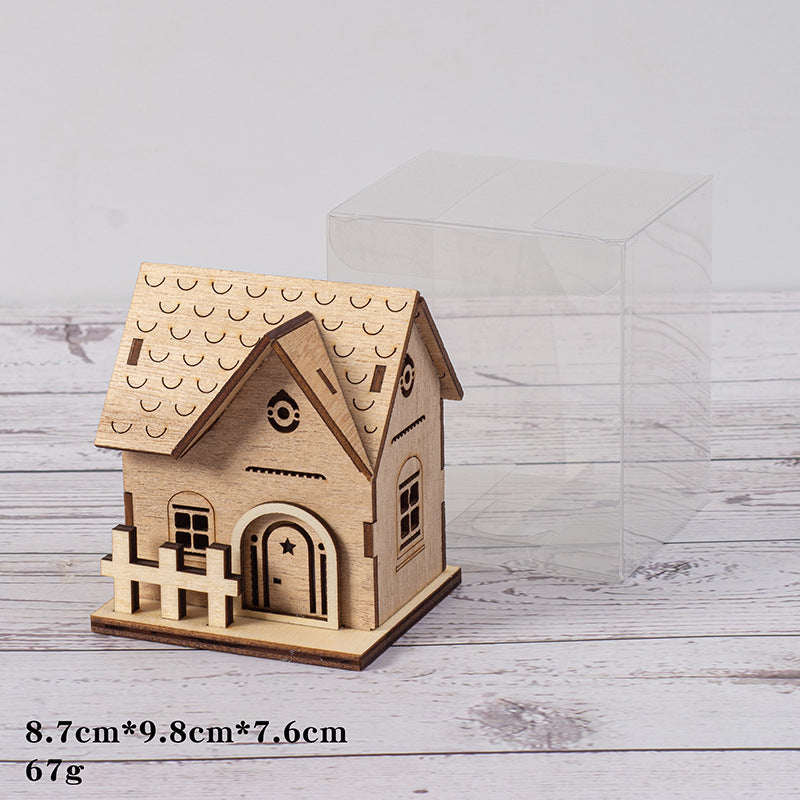 Illuminated wooden house for Christmas decoration