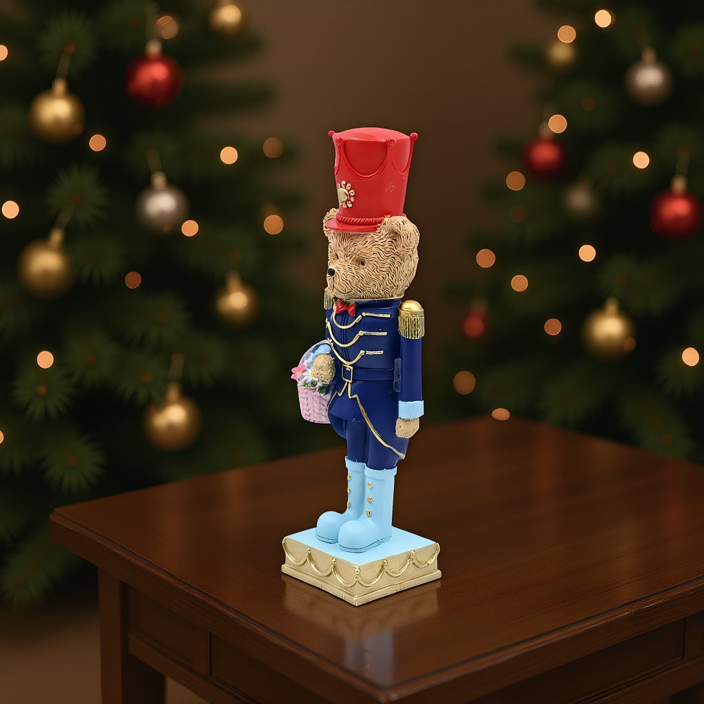 Decorative nutcracker figure with bear, synthetic resin