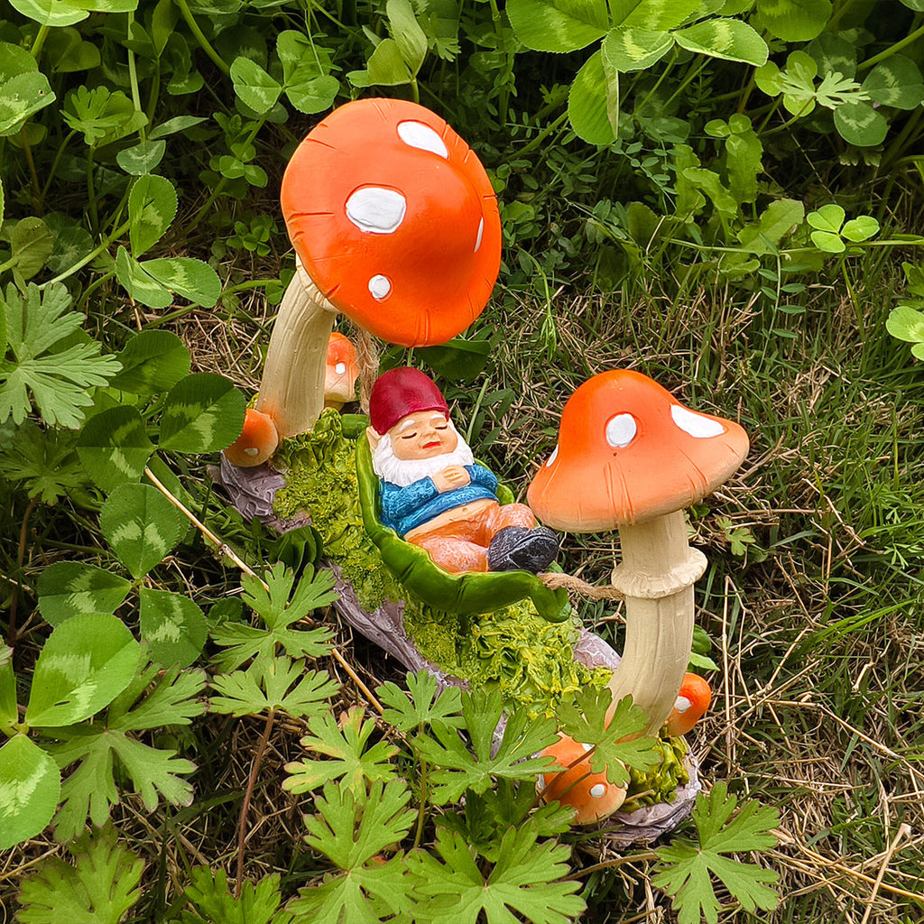 Garden decoration gnome in hammock made of synthetic resin