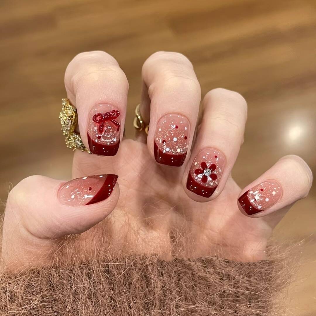 Artistic Nail Design with Decorative Elements 
Maetiva