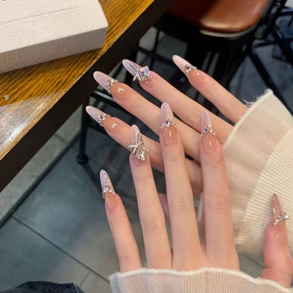 Artistic Nail Design with Decorative Elements 
Maetiva
