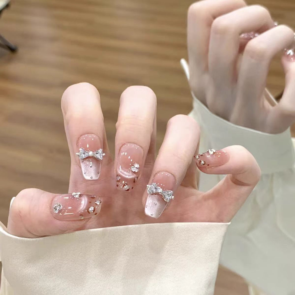 Artistic Press-On Nail Design with Floral Accents 
Maetiva