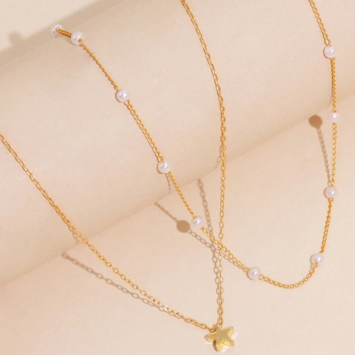 Layered Pearl and Star Pendant Necklace 
Maetiva