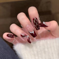 Artificial nails with elegant pearl and glitter decorations 
Maetiva