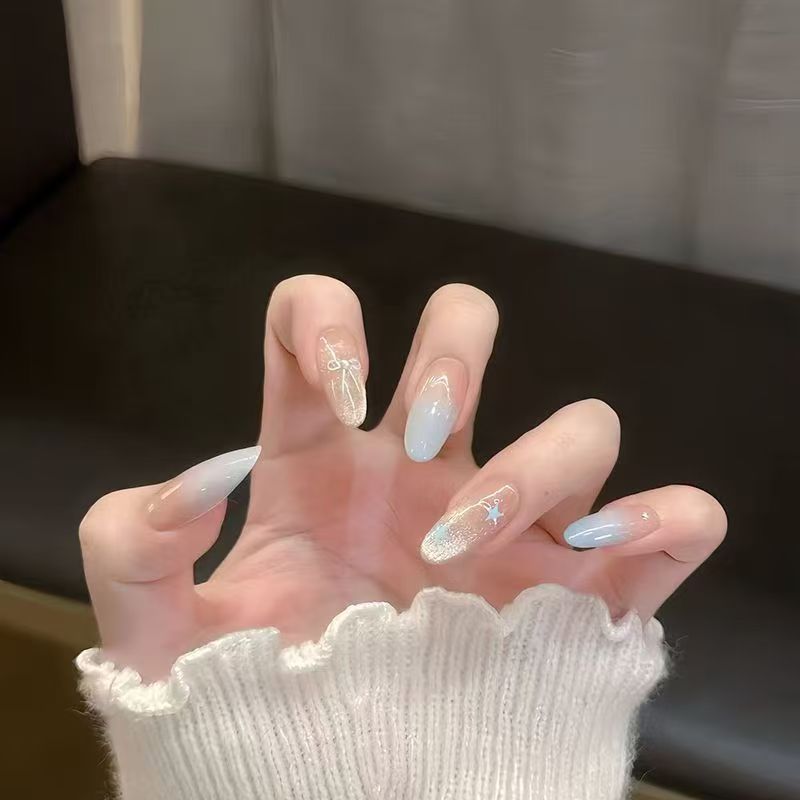 Ombre Stiletto Press-On Nail Art with Gem Accents 
Maetiva