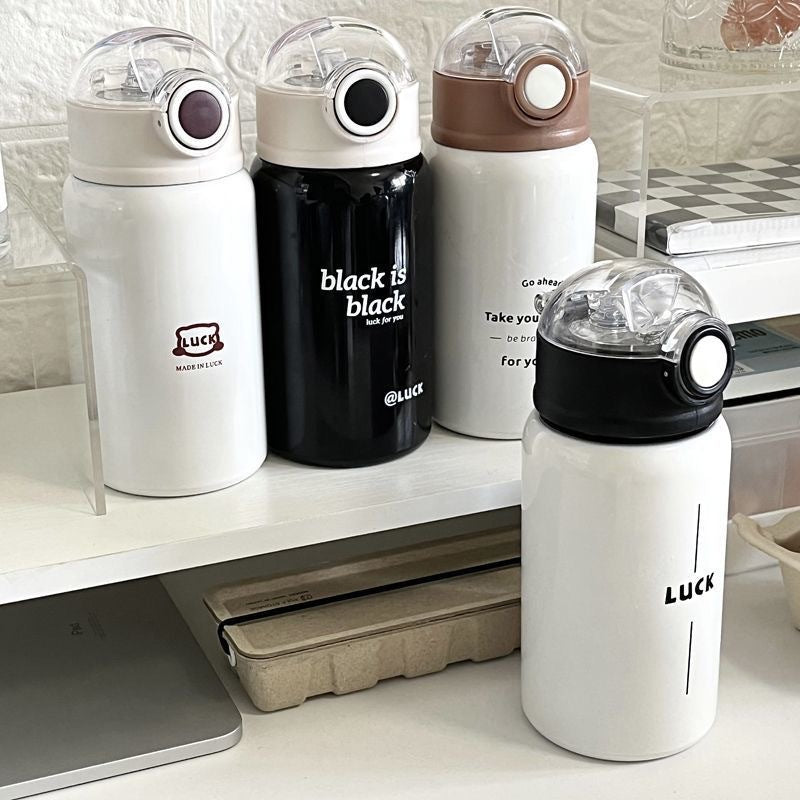 Women's insulated drinking bottle with innovative flip lid and practical handle 
Maetiva