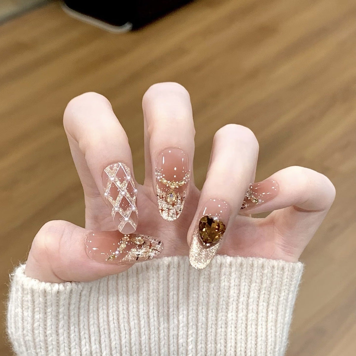 Artistic Nail Design with Decorative Elements 
Maetiva