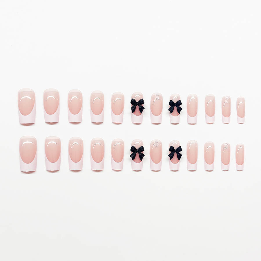 Acrylic nail set with stylish black and pearl details 
Maetiva