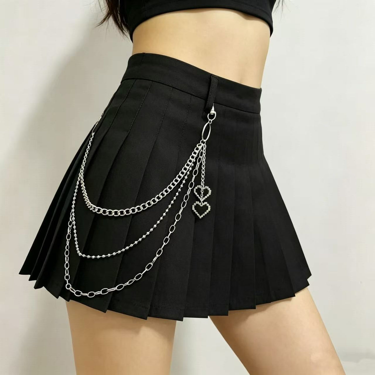 Pleated skirt with stylish chains by 
Maetiva