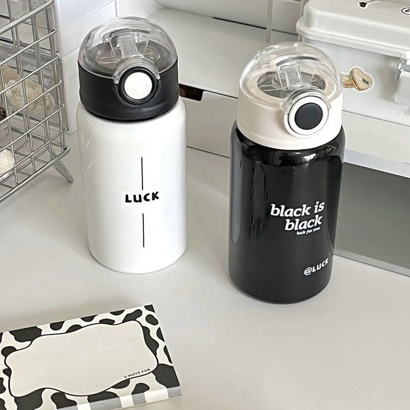 Women's insulated drinking bottle with innovative flip lid and practical handle 
Maetiva