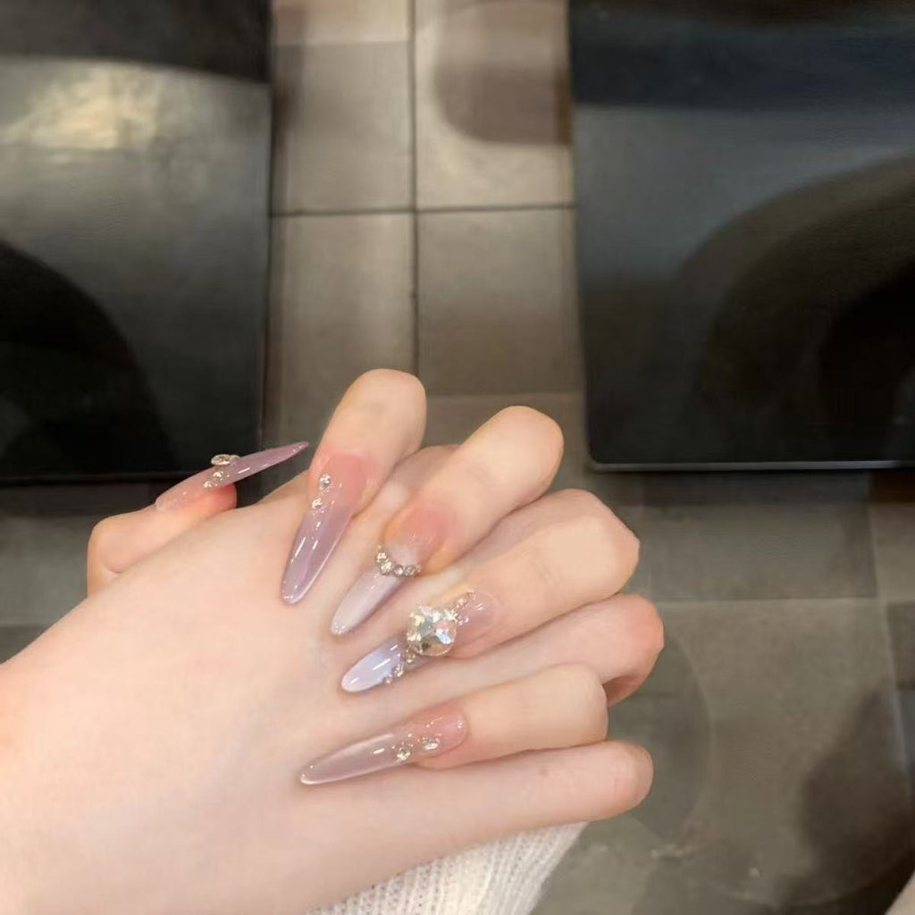 Artistic Nail Design with Decorative Elements 
Maetiva