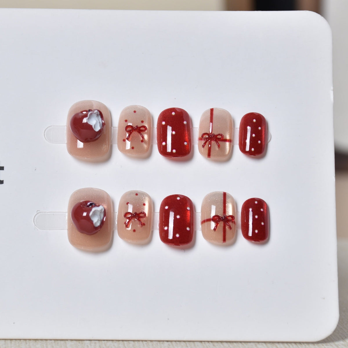 Artistic Nail Design with Decorative Elements 
Maetiva