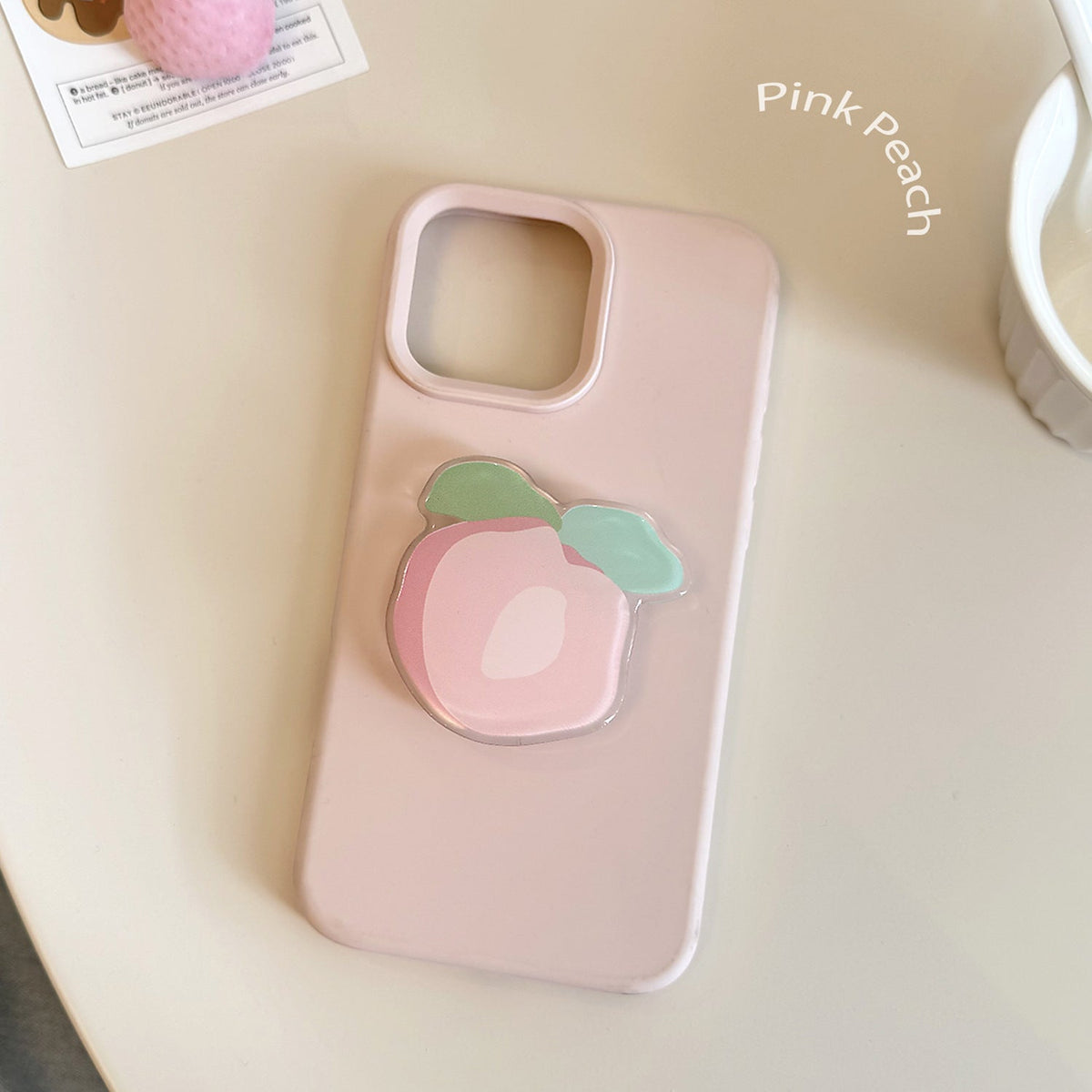 Original coaster in peach-shaped design 
Maetiva