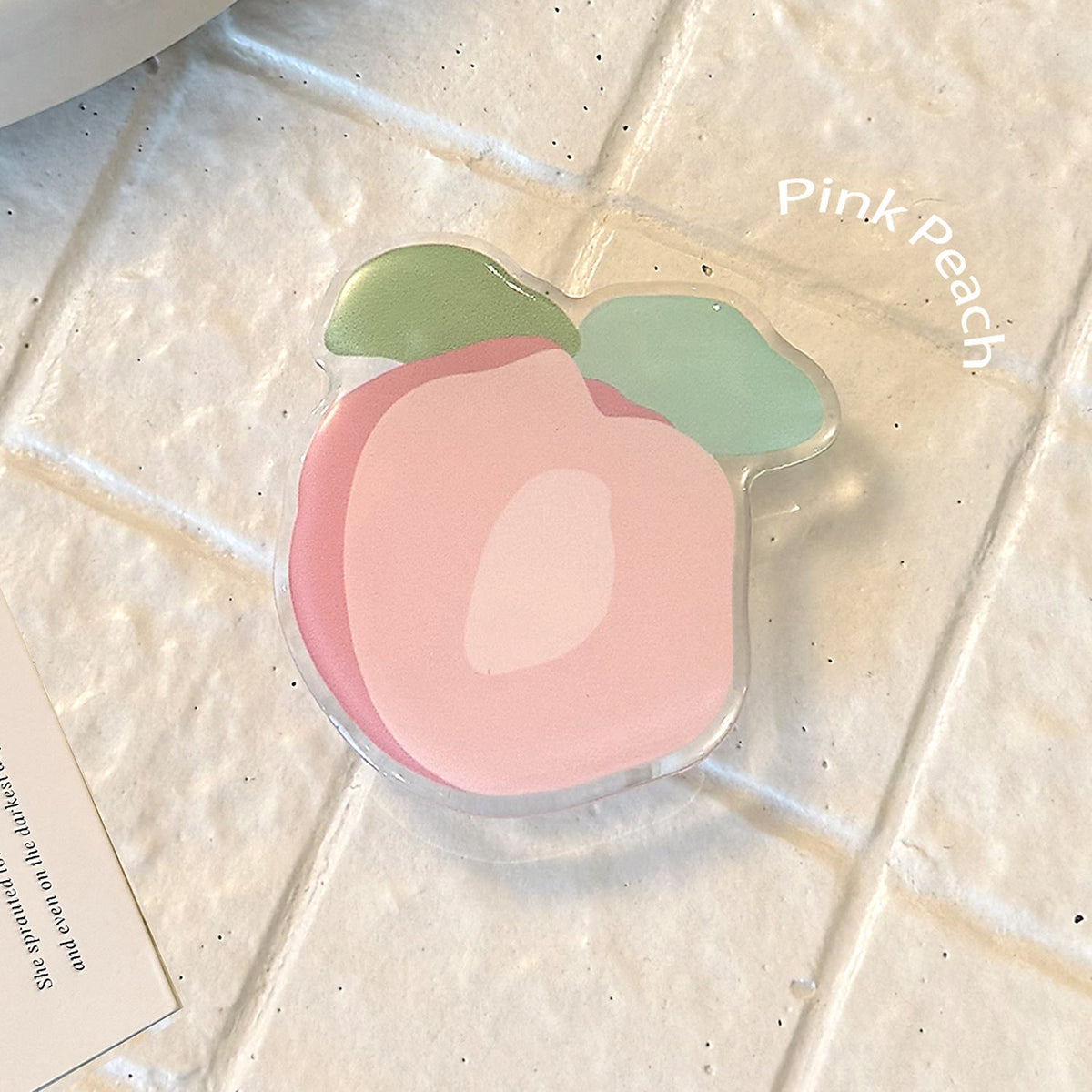 Original coaster in peach-shaped design 
Maetiva