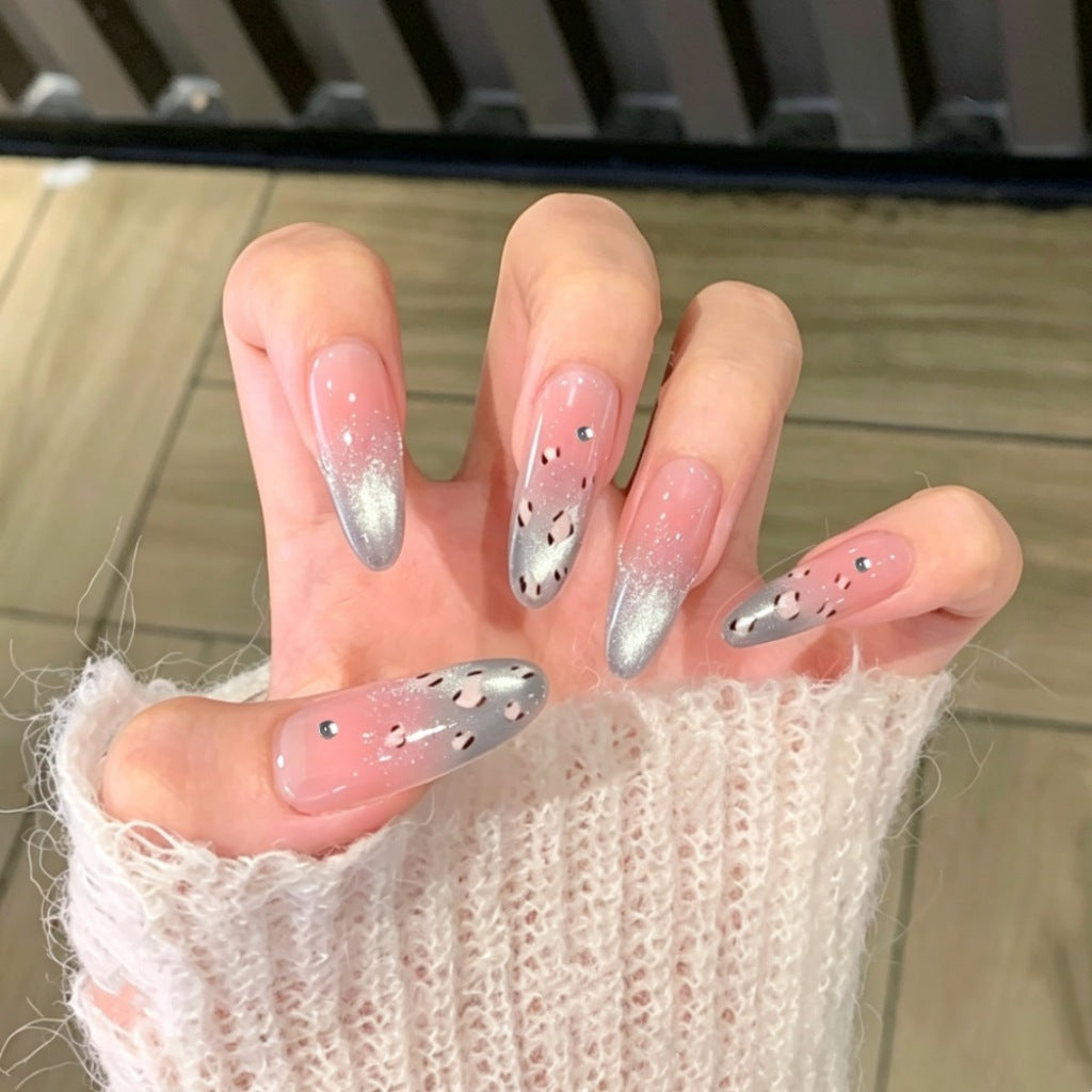 Ombre Stiletto Press-On Nail Art with Gem Accents 
Maetiva