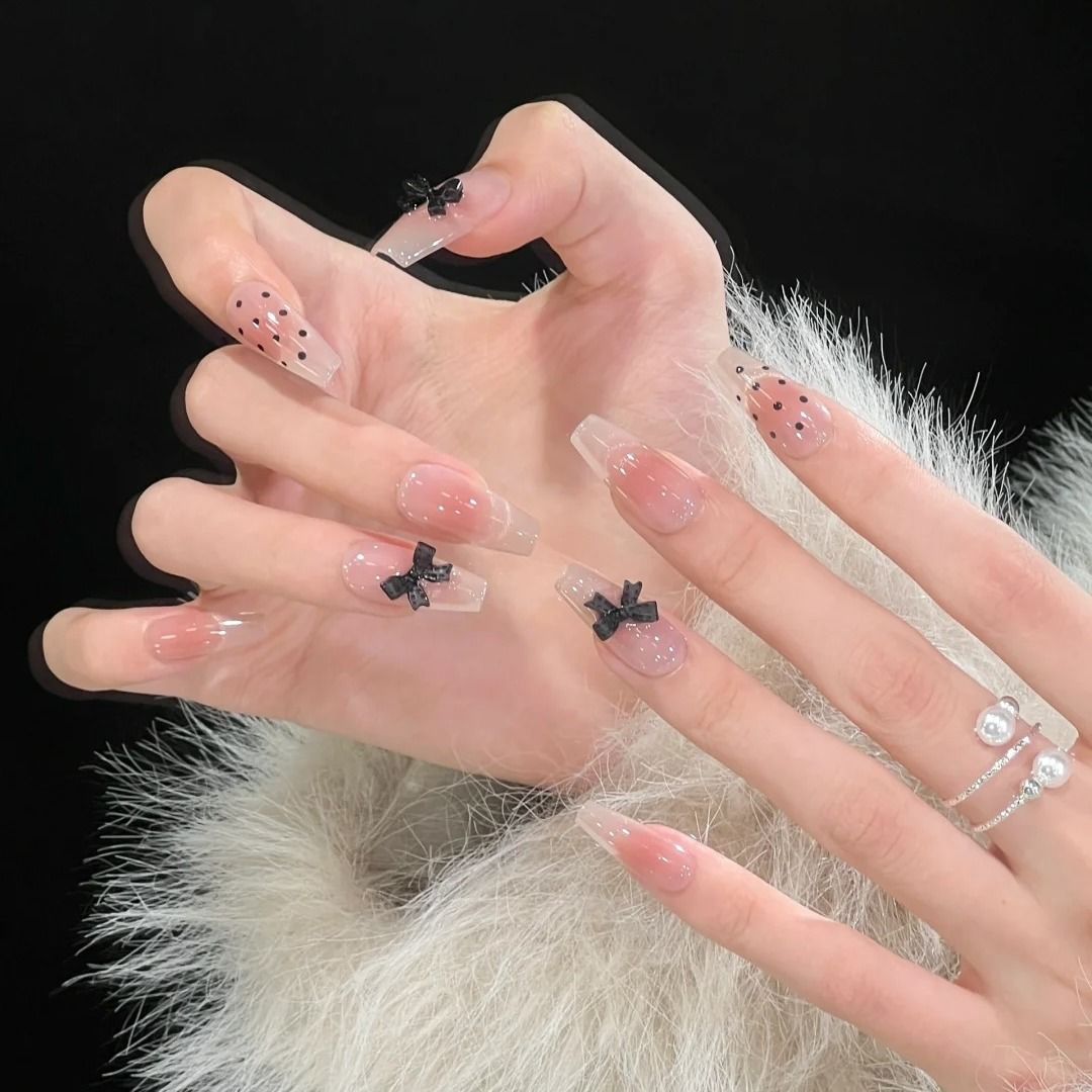 Artistic Long Stiletto Press-On Nails with Bow Accents 
Maetiva