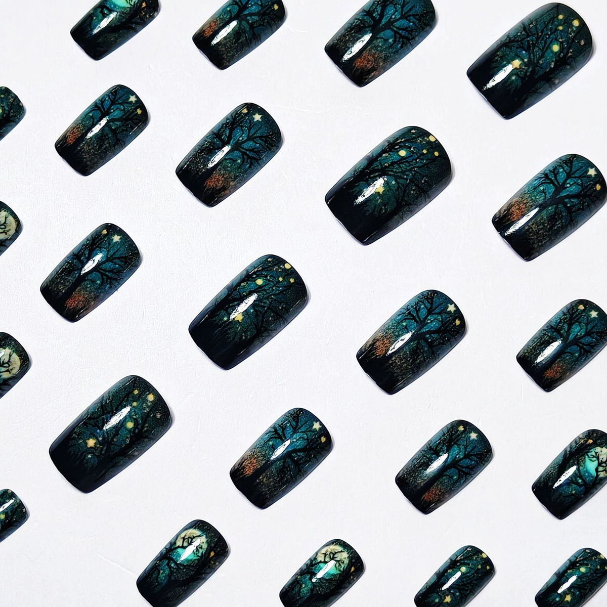 Creative Acrylic Nails with Midnight Forest Design 
Maetiva