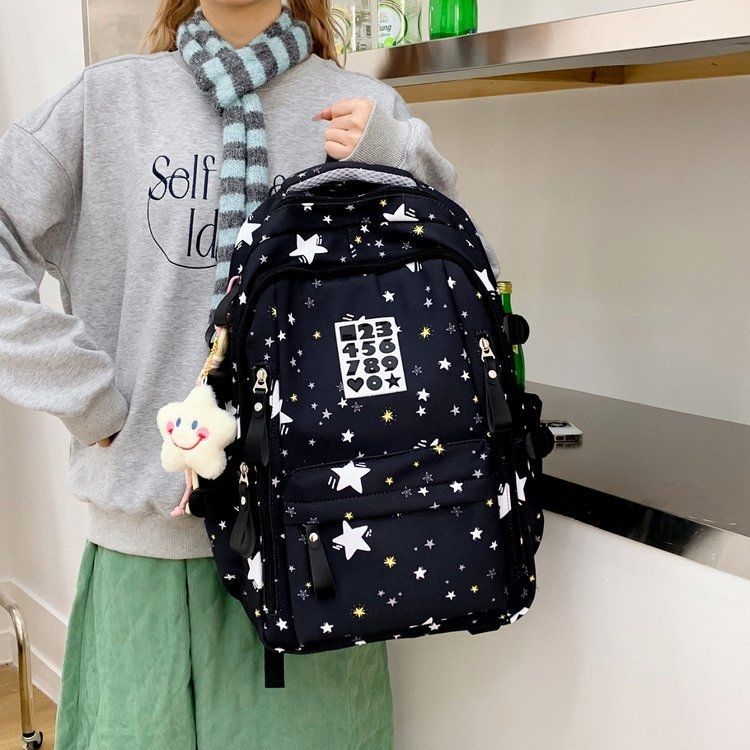 Playful backpack with star motifs and practical functions 
Maetiva