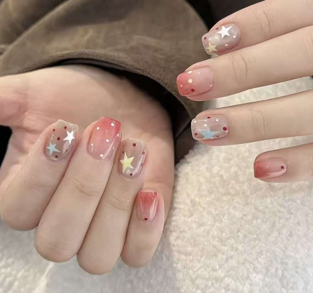 Ombre Stiletto Press-On Nail Art with Gem Accents 
Maetiva