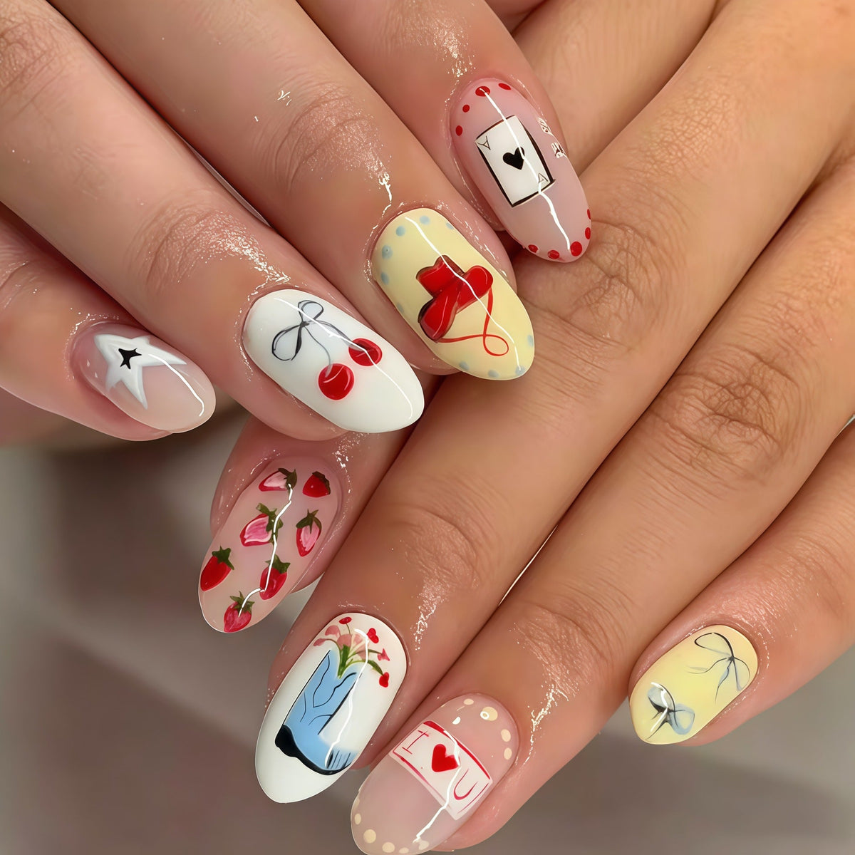 Thematic Hand-Painted Nail Art Extensions 
Maetiva