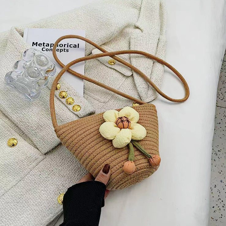 Handcrafted shoulder bag with flower applique 
Maetiva