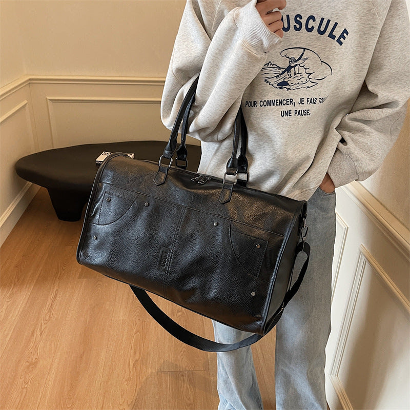 Elegant and Spacious Travel Bag Made of Durable Faux Leather 
Maetiva