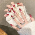 Ombre Stiletto Press-On Nail Art with Gem Accents 
Maetiva
