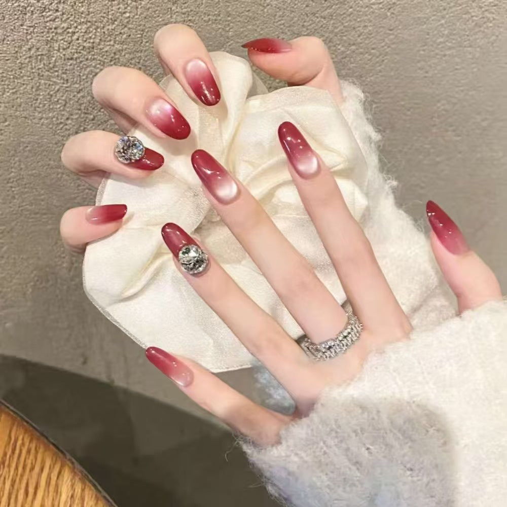 Ombre Stiletto Press-On Nail Art with Gem Accents 
Maetiva