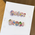 Artificial nails with sparkling crystal accents 
Maetiva