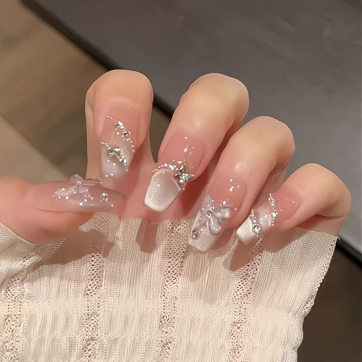Ombre Stiletto Press-On Nail Art with Gem Accents 
Maetiva