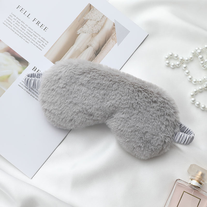Women's fluffy ergonomic eye mask with adjustable satin band and soft faux fur cover 
Maetiva
