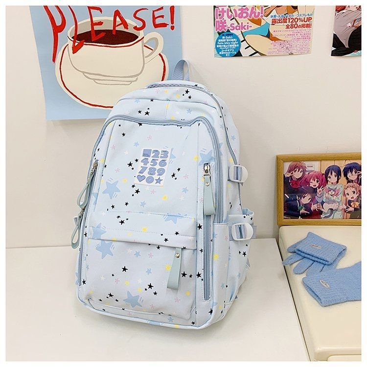 Playful backpack with star motifs and practical functions 
Maetiva
