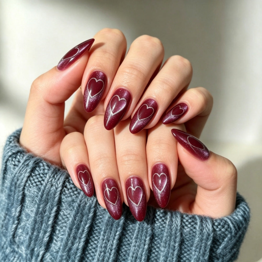 Artificial nails with romantic heart design 
Maetiva