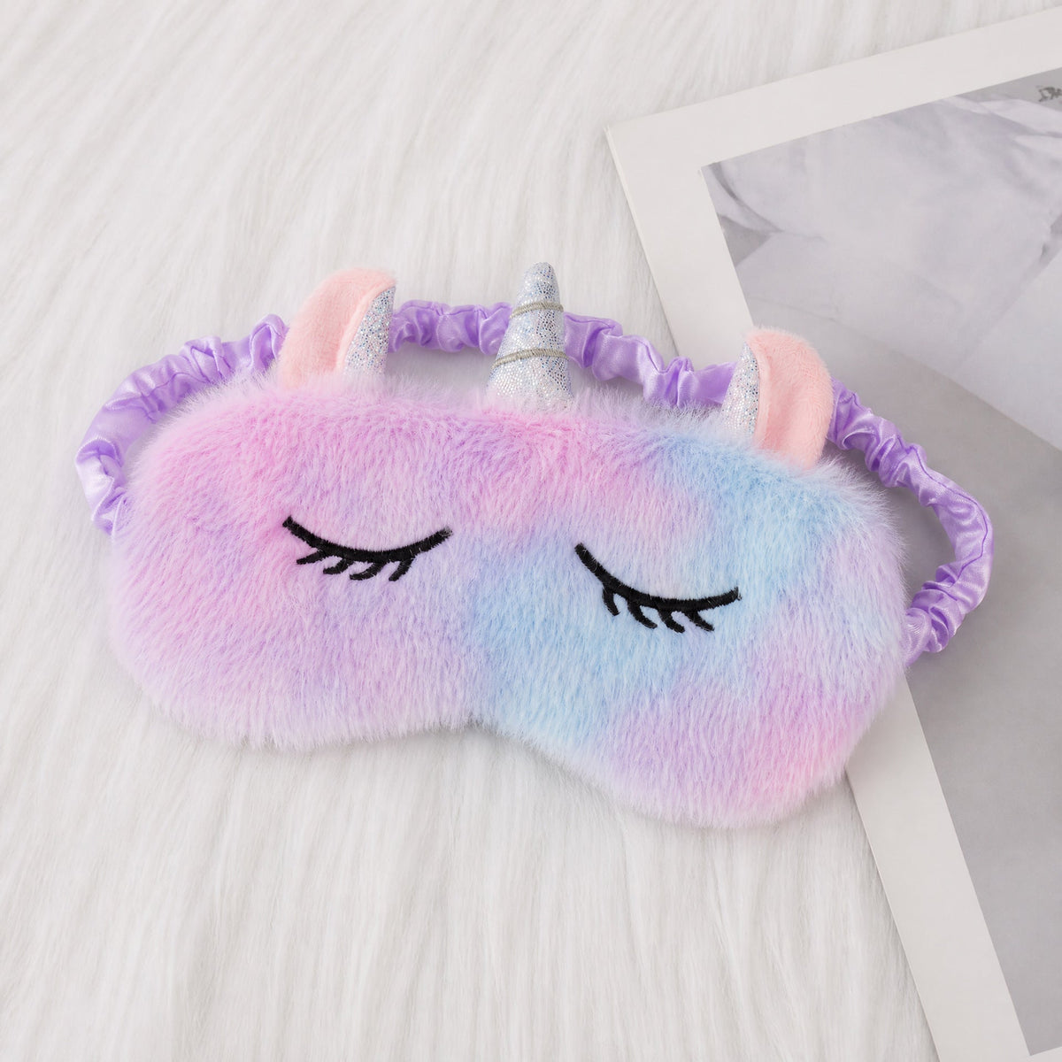 Ladies nan cozy unicorn sleep mask with embroidered eyelashes, soft plush and elastic ruffled ribbon 
Maetiva