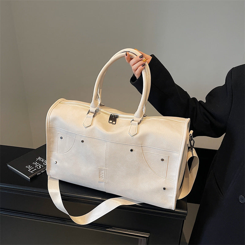 Elegant and Spacious Travel Bag Made of Durable Faux Leather 
Maetiva