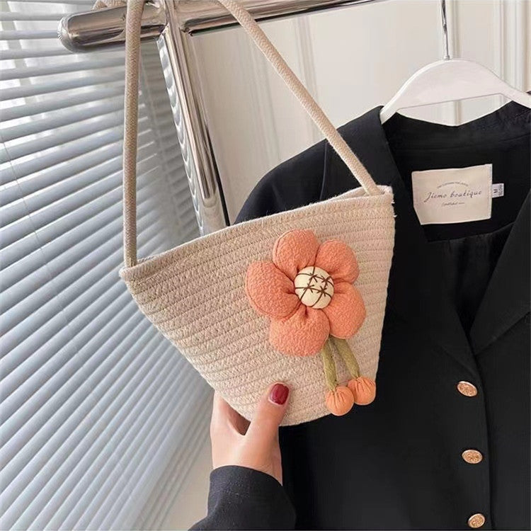 Handcrafted shoulder bag with flower applique 
Maetiva